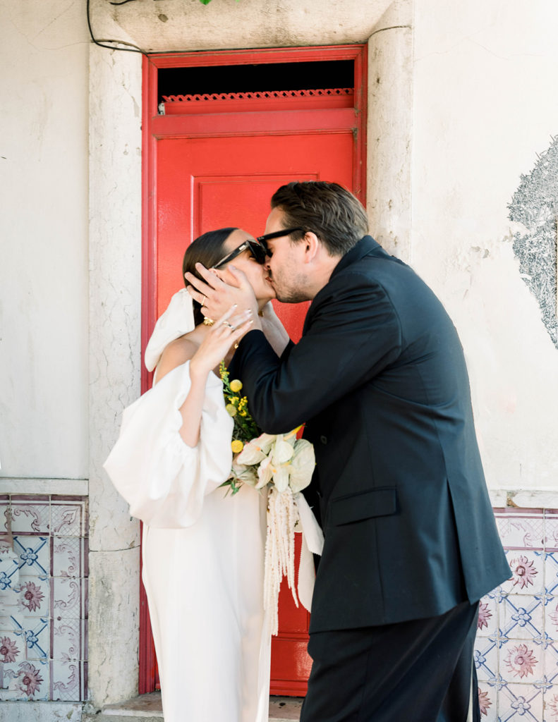 First kiss of the bride and groom at their Lisbon wedding