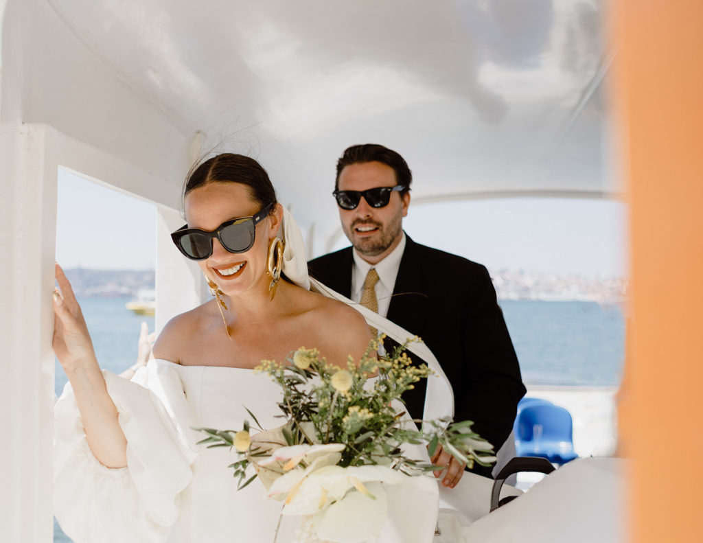 Bride and groom getting of the boat in Lisbon