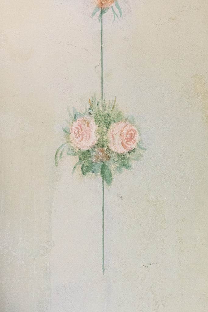 flowers painted on the wall of a villa in tuscany
