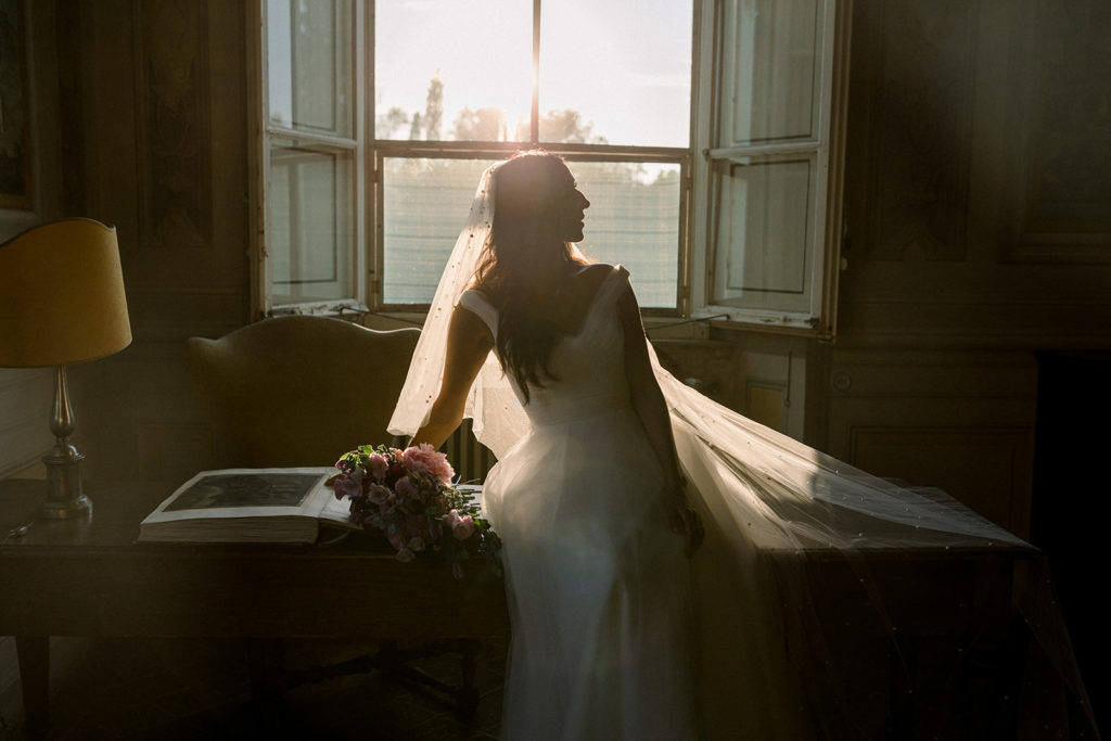 Bride sitting in a sunset light